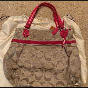 Tan coach bag with bunk leather details